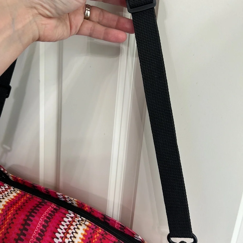 Like new YakPak duffle bag. Pink colorful zigzag design with black details